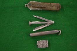 An engraved silver vinaigrette and a silver smokers companion with case.