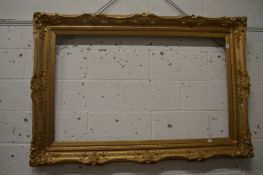 A large gilt frame.