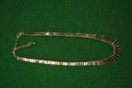 A fringe necklace with 9 carat gold clasp.