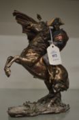 A cast model of Napoleon on horseback.