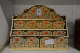 A Persian style lacquer stationery rack.