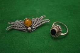 A dress ring and a brooch.