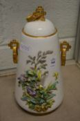 A floral decorated vase and cover.