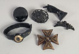 THREE JET BROOCHES, A CROSS, LOCKET AND BRACELET. 60gms.