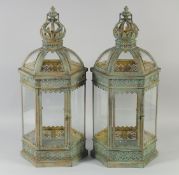 A PAIR OF OCTAGONAL LANTERNS with crown finials. 2ft high