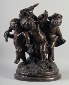 A LARGE AND IMPRESSIVE BRONZE OF CHILDREN PLAYING. 20ins high.