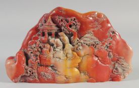 A GOOD CHINESE CARVED HARDSTONE BOULDER. 10ins wide.