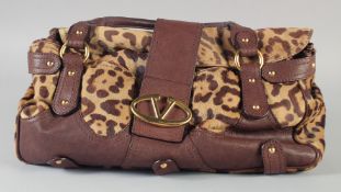 A VALENTINO LEATHER BAG. 43cm long, 26cm high in a blue dust bag.