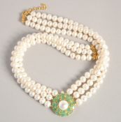 A PEARL NECKLACE with GOLD PLATED ELEPHANT CLASP.