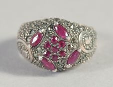 A SILVER RUBY AND MARCASITE RING.