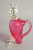 A SMALL RUBY GLASS BIRD CLARET JUG. 4.75ins high.