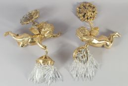 A GOOD PAIR OF BRONZE CUPID HANGING LIGHTS on a chain.