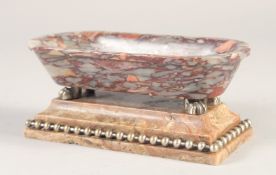 A GOOD SMALL GRAND TOUR MARBLE BATH, on a brass bound marble base. 6.5ins long.