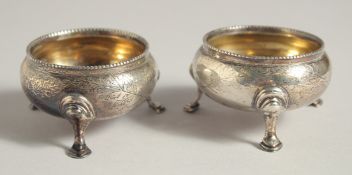 A PAIR OF VICTORIAN CIRCULAR SALTS with bead edge or three pad feet. London 1867.