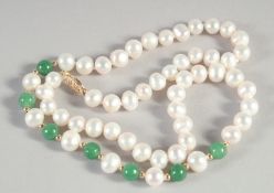 A SMALL 14CT GOLD PEARL AND JADE NECKLACE.