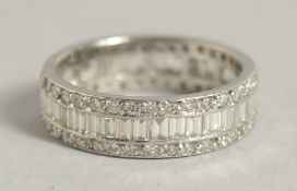 A SUPERB EDWARDIAN PLATINUM DIAMOND BAND RING.