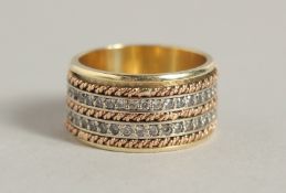 AN 18CT YELLOW GOLD DIAMOND SET DOUBLE BAND RING.
