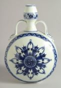 A CHINESE BLUE AND WHITE PORCELAIN TWIN HANDLED MOON FLASK with central radiating Ying-Yang