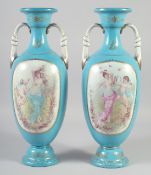 A PAIR OF CONTINENTAL LIGHT BLUE CLASSICAL SCENE VASES AND COVERS. 18ins high.