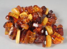 A GRADUATED AMBER FACETED NECKLACE, 64 beads, 21ins long, 68gms.