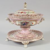 A CONTINENTAL PINK PORCELAIN CIRCULAR TUREEN, COVER AND STAND.