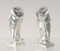 A PAIR OF ART DECO STYLE OWL SALT AND PEPPERS. 2.75ins high.