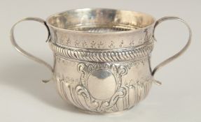 A GEORGE 1ST SILVER TWO HANDLED CIRCULAR PORRIGER. 3ins diameter, 2.5ins high. London 1718. Maker