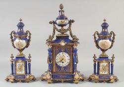 A SEVRES STYLE BLUE AND GROUND AND ORANGE THREE PIECE CLOCK GARNITURE with swags and gull