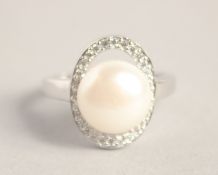 A SILVER PEARL RING.