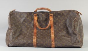 A 1960's - 1970's LOUIS VUITTON LARGE LEATHER HOLDALL. 70cm long x 50cm high.