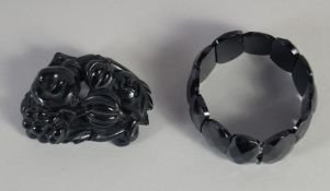A WHITBY JET BRACELET AND CARVED BROOCH (2).