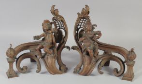 A PAIR OF BRONZE FIGURAL CHENETS. 12ins high.