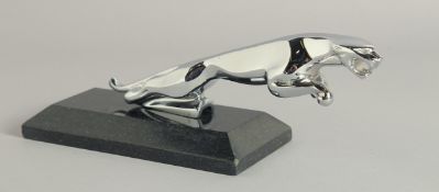 A CHROME JAGUAR MASCOT on a marble base.