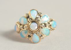 A GOOD 9CT GOLD OPAL AND DIAMOND CLUSTER RING.