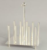 A SMALL CHRISTOPHER DRESSER STYLE TOAST RACK.