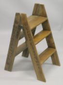 A NOVELTY PINE STEP LADDER. 2ft 8ins high.