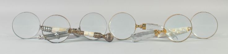 A SET OF SIX VARIOUS MAGNIFYING GLASSES.