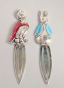 A PAIR OF SILVER AND ENAMEL BEATRIX POTTER BOOK MARKS.