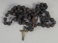 A LONG JET ROSARY. 68ins long.