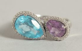 AN 18CT WHITE GOLD TWO STONE TOPAZ, AMETHYST AND DIAMOND RING.