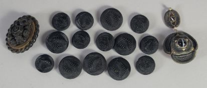 FOURTEEN JET BUTTONS, A CARVED BROOCH AND PENDANT.