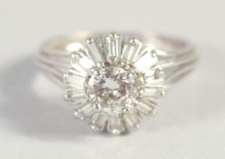 AN 18CT WHITE GOLD, DIAMOND CLUSTER RING with central diamond surrounded by baguette diamonds.
