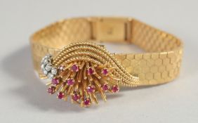 A LADIES 18CT YELLOW GOLD ROLEX COCKTAIL WATCH set with rubies and diamonds.