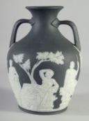 A GOOD BLACK AND WHITE JASPER WARE PORTLAND VASE. Circa. 1780. 10.5ins high, the base with the