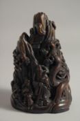 A CHINESE SIMULATED HORN FIGURAL GROUP. 18.5cm high.