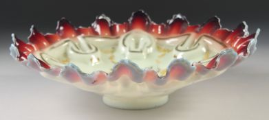 A 19TH CENTURY FRENCH OPALINE CIRCULAR DISH painted with garlands. 10.5ins diameter.