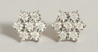 A GOOD PAIR OF 9CT GOLD DIAMOND CLUSTER EARRINGS.