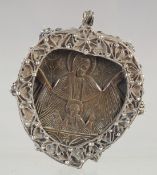A RARE 18TH CENTURY GREEK OTTOMAN ENKOLPION CARVED RHINO HORN ICON. 5cm x 4.5cm, one side carved