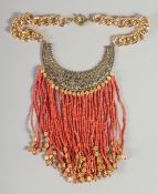 A GOOD ISLAMIC GILT METAL AND CORAL NECKLACE with forty two rows of coral