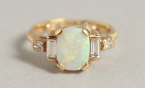 AN 18CT YELLOW GOLD OPAL AND DIAMOND RING.